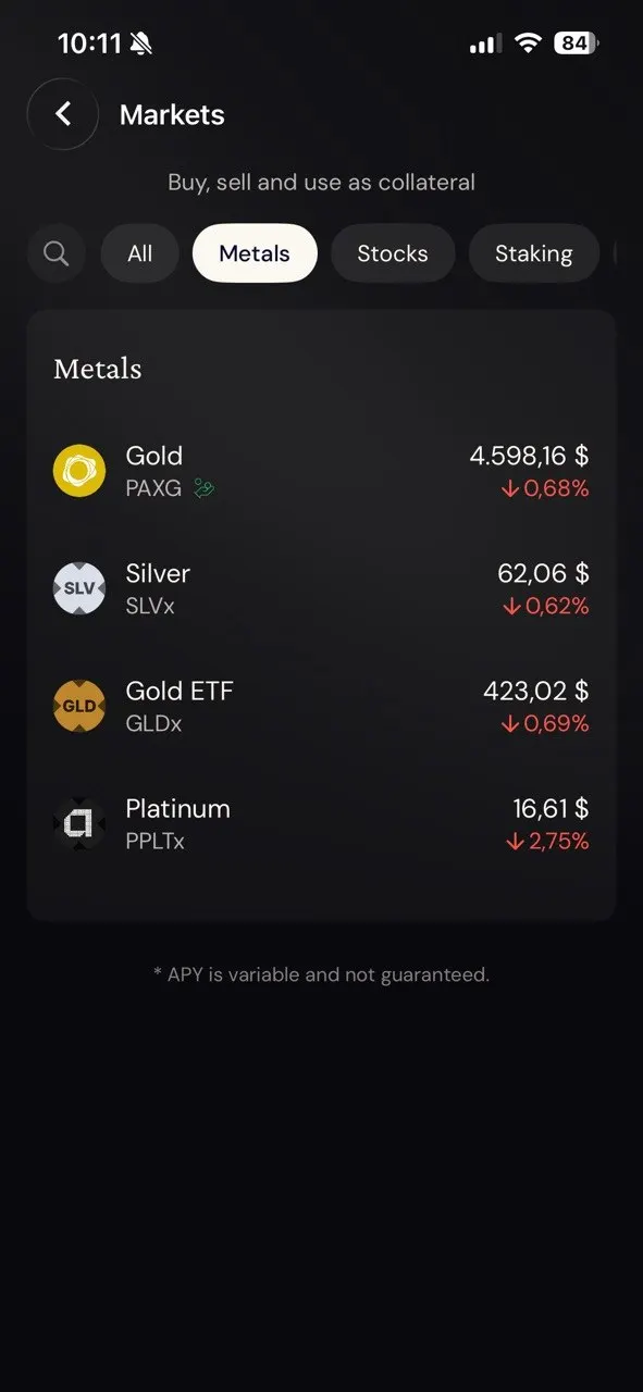 Ether.fi Markets metals tab: gold PAXG, silver SLVx, gold ETF GLDx, platinum PPLTx, under the header Buy, sell and use as collateral, with the footnote APY is variable and not guaranteed